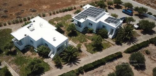 an aerial view of a house with solar panels on it at Notos Villas in Frangokastello