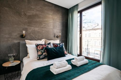 Ein Bett oder Betten in einem Zimmer der Unterkunft Vistula Apartments by LoftAffair