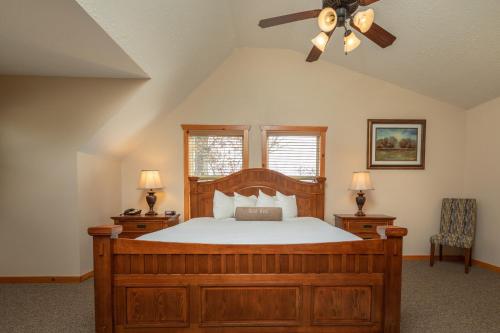 a bedroom with a bed and a ceiling fan at The Lodges at Table Rock in Branson