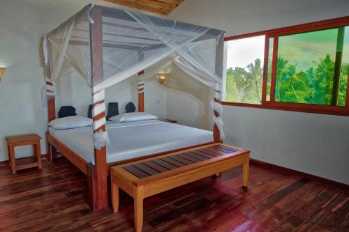 Katil atau katil-katil dalam bilik di Emeraude Lodge