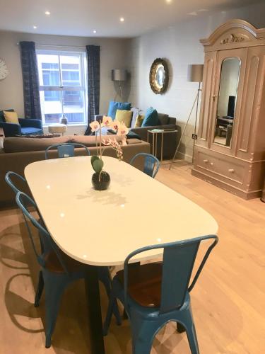 a table and chairs in a living room at Blue River, Parking subject to availability in York