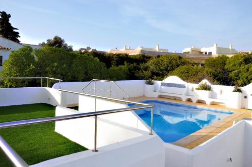 a swimming pool on the roof of a house at Villa on the Beach by GalanteVasques in Carvoeiro