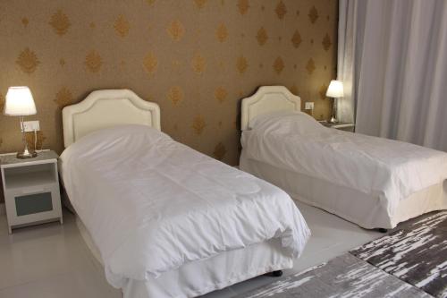 Cama o camas de una habitación en بوابة الرمال السياحية Tourism sands gate