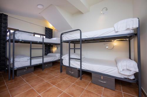 Ένα ή περισσότερα κρεβάτια σε δωμάτιο στο Hostel La Pedriza