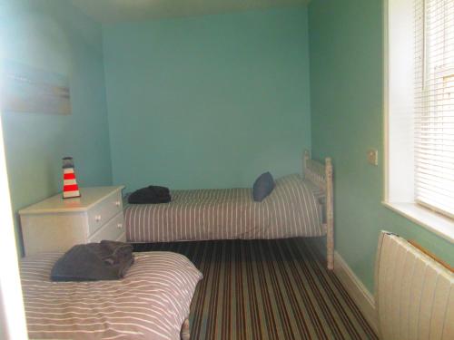 a bedroom with two bunk beds in a room at Weston Manor in Freshwater