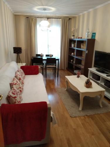 a living room with a couch and a table at El Collado 17 in Soria