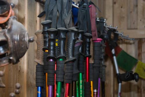 a bunch of guns hanging on a wall at Wander Thirst in Kathmandu