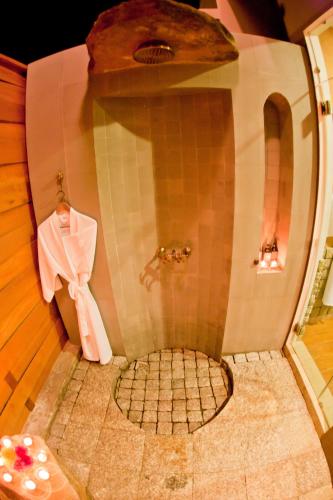 a shower with a tiled floor in a room at Phukumhom Khao Yai in Wangkata