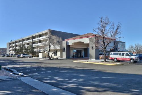 a parking lot in front of a building at Ramada by Wyndham Albuquerque Midtown in Albuquerque