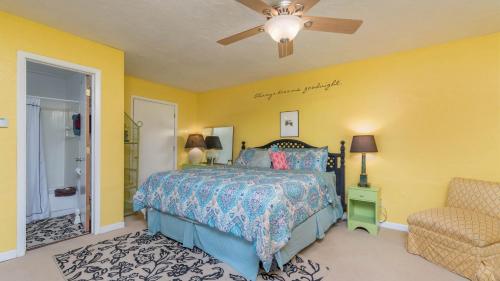 a bedroom with a bed and a ceiling fan at Lands End in Ruidoso