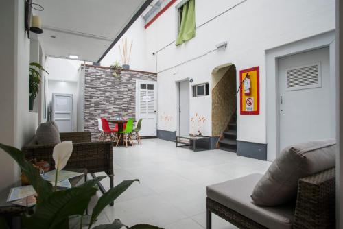 a living room with a couch and a table at Hotel Casablanca Montevideo in Montevideo