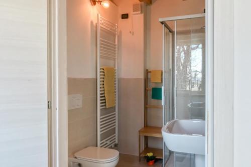a bathroom with a toilet and a sink at Agriturismo Croce del Gal in Verona