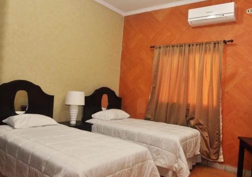 Ein Bett oder Betten in einem Zimmer der Unterkunft Apart Hotel K-Lisma