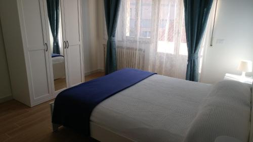 a bedroom with a bed and a window at Senigallia d'aMare in Senigallia