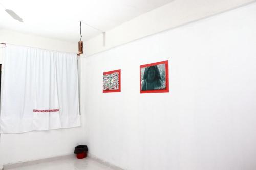a white room with three pictures on the wall at Hotel Boutique Otomi cerca de Tolantongo in Cardonal