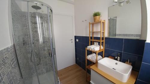 a bathroom with a sink and a shower at Senigallia d'aMare in Senigallia