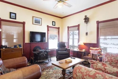 a living room with a couch and a table at Rose Street Bed & Breakfast in Georgetown