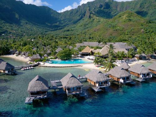 an aerial view of a resort in the water at Manava Beach Resort & Spa Moorea in Maharepa