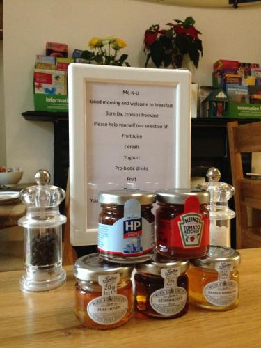 a picture of a frame with jars of food at Langland Road B&B in The Mumbles
