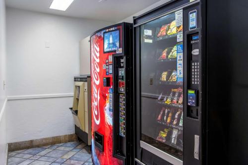 two vending machines with soda and snacks in a room at Motel 6-Wilsonville, OR - Portland in Wilsonville