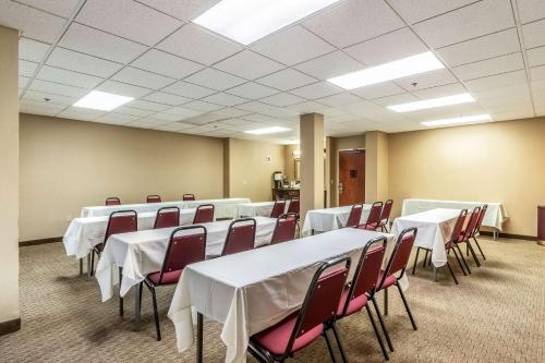 a conference room with white tables and chairs at Motel 6-Conway, AR in Conway