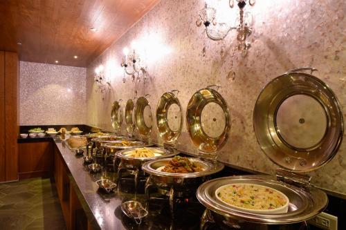 a buffet line of plates of food in a restaurant at U-Her Hotel in Taichung