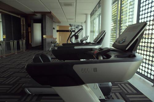 a row of exercise bikes in a gym at Emerald Palace Hotel in Nay Pyi Taw