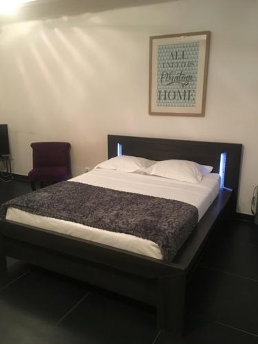 Postel nebo postele na pokoji v ubytování Les Appartements Berthe Molly
