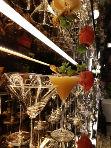 a row of wine glasses with a cocktail at Inhouse Hotel Grand in Taichung