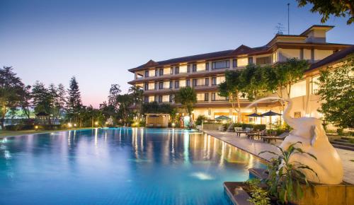 a large swimming pool in front of a building at The Imperial River House Resort, Chiang Rai in Chiang Rai