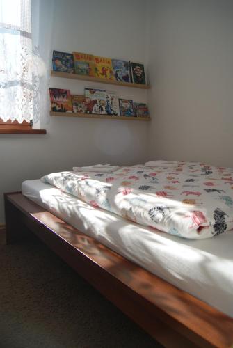 a bed in a room with at Przybobrze Apt. in Jelenia Góra