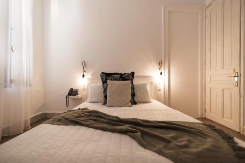 Una cama o camas en una habitación de Kumba Hostel