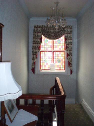 a room with a window with a chair and a table at Wentvale in Knottingly