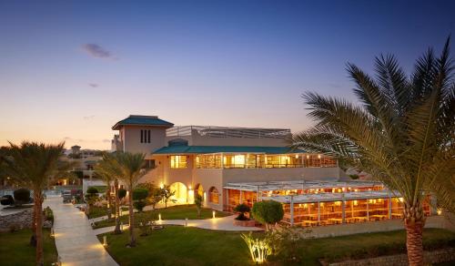 a building with a lot of lights on it at Coral Sea Holiday Resort and Aqua Park in Sharm El Sheikh