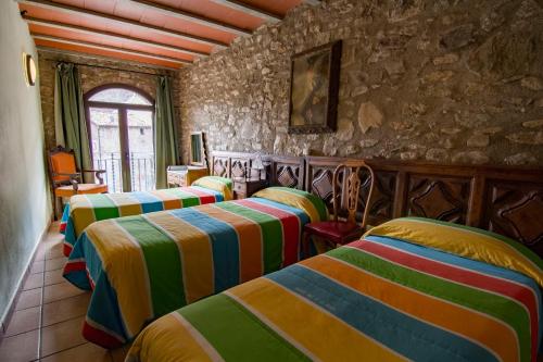 Un pat sau paturi într-o cameră la Casa Batlle