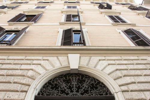 an entrance to a building with an arch over a door at Hotel Ciao in Rome