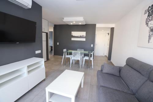 a living room with a couch and a table at DIFFERENTFLATS Grd in Salou