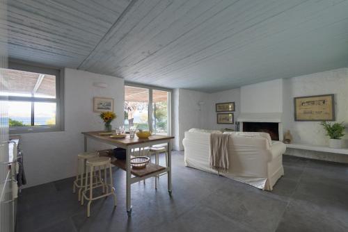 a living room with a couch and a table at Megara sur Mer in Megara