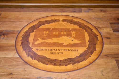 a wooden board with a picture of a fish on it at Antica Locanda Sturion Residenza d'Epoca in Venice