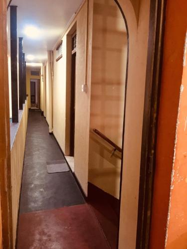 an empty hallway of an office building with a hallway at Sea Sands Beach Hostel in Negombo