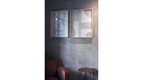 a room with two mirrors and a table at c-hotels Diplomat in Florence