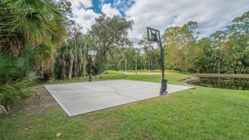 a basketball court in a park with a basketball hoop at Barefoot Suite in Orlando