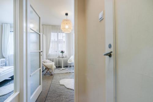 a hallway with a door and a room with a table at Old Town Studio Apartment in Prague