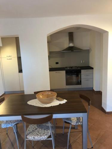 a kitchen with a table with a bowl on it at La Finestra sul mare in La Spezia