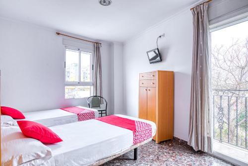 Кровать или кровати в номере Hostal Nova Picanya