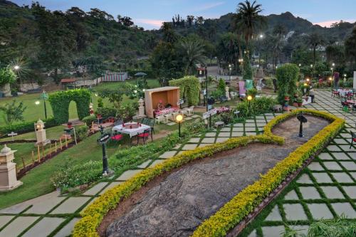an aerial view of a park at dusk at Chacha Inn The Garden Retreat in Mount Ābu