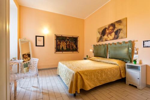 A bed or beds in a room at Merulana Suite 2