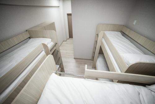 two bunk beds in a small room with at Sergeev Hotel in Mykolaiv