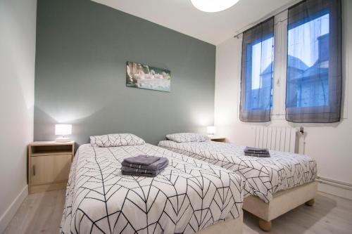 Кровать или кровати в номере Appartement hypercentre Tarbes