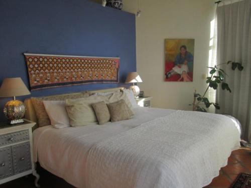Una cama o camas en una habitación de Casa Carly